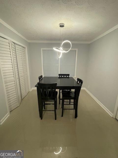 dining space featuring a textured ceiling and ornamental molding