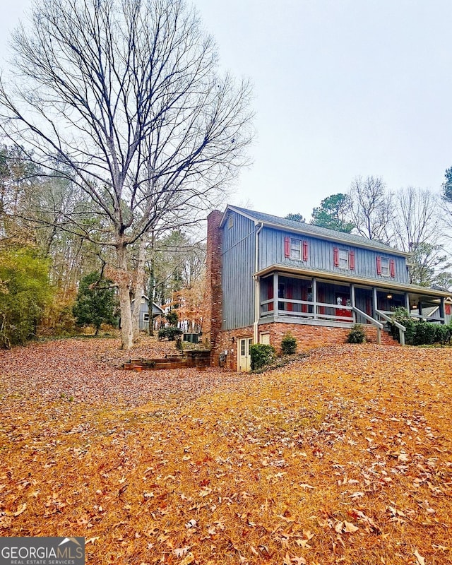 view of front of home with a sunroom