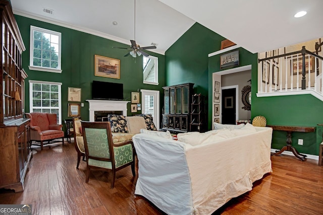 living room featuring high vaulted ceiling, hardwood / wood-style flooring, plenty of natural light, and ceiling fan