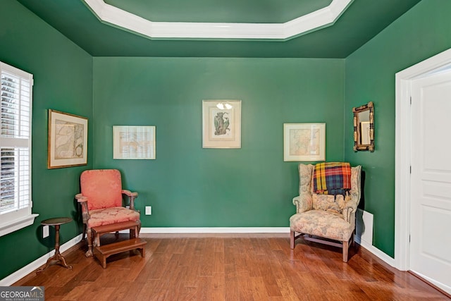 sitting room featuring hardwood / wood-style floors and plenty of natural light