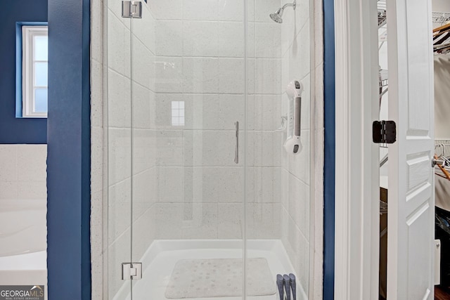 bathroom featuring an enclosed shower