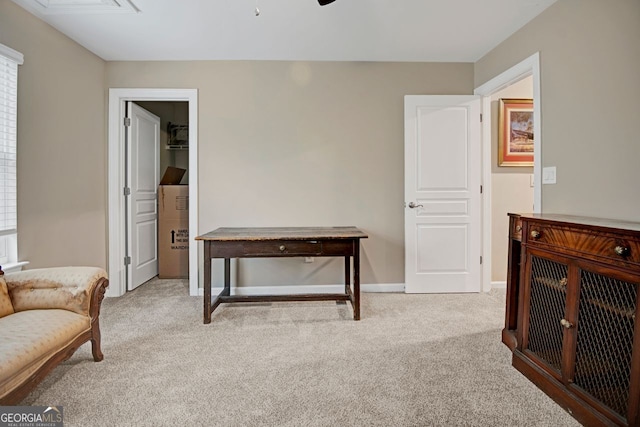 sitting room with light colored carpet