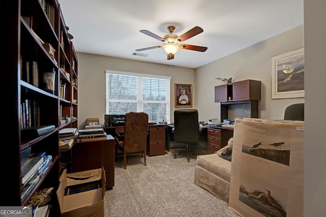 office area with ceiling fan and light colored carpet