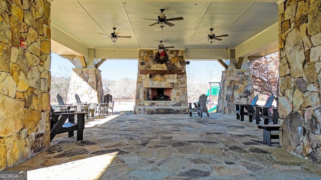 view of patio / terrace with an outdoor stone fireplace