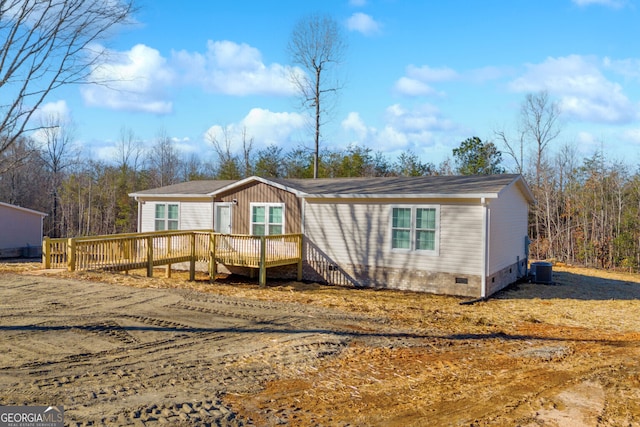 view of front of house featuring central AC and a deck