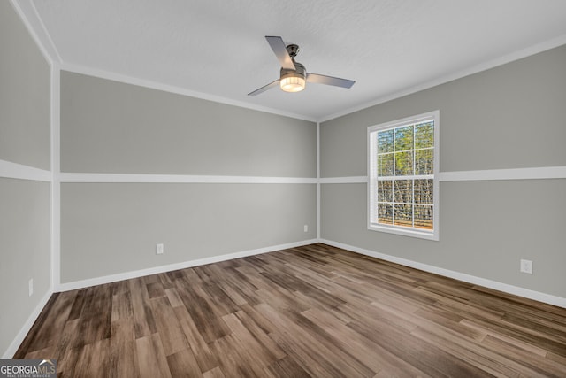 unfurnished room featuring hardwood / wood-style flooring, ceiling fan, and ornamental molding