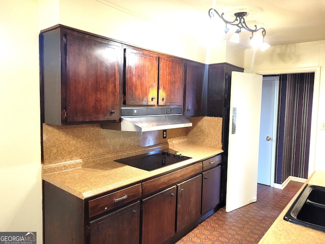 kitchen featuring sink, black electric stovetop, and dark brown cabinetry