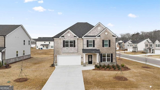 view of front of home with a front lawn and a garage