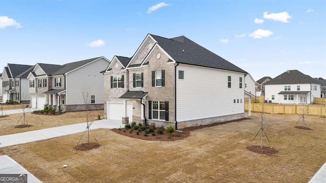 view of home's exterior with a garage and a yard