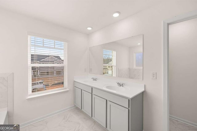 bathroom with vanity and plenty of natural light