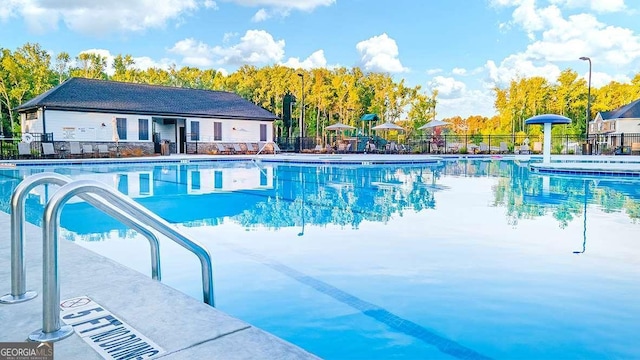 view of swimming pool with a patio area