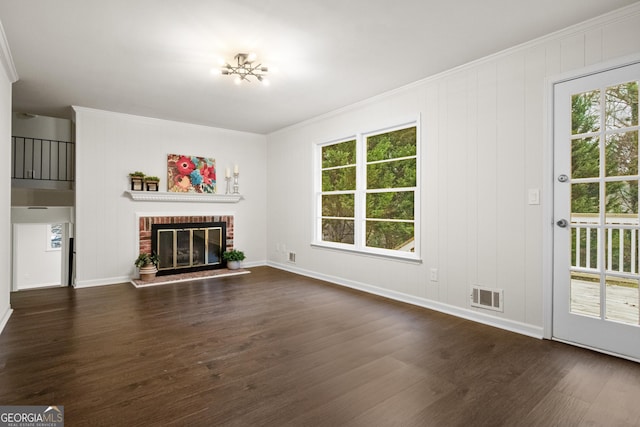 unfurnished living room with plenty of natural light, dark hardwood / wood-style flooring, and a fireplace