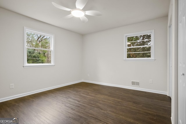 unfurnished room featuring dark hardwood / wood-style floors and ceiling fan