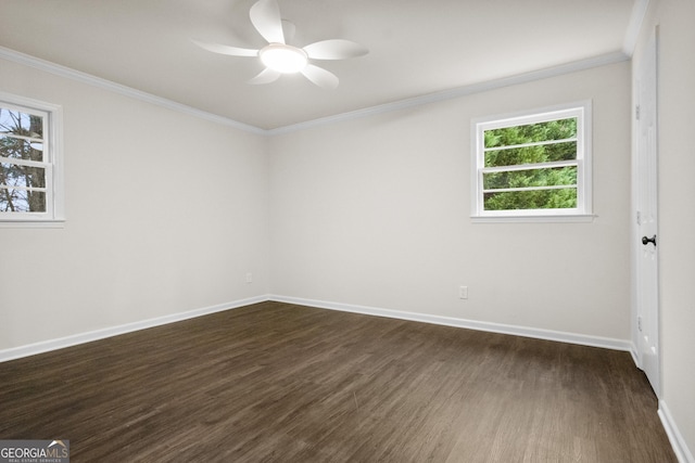 empty room featuring dark hardwood / wood-style flooring, ceiling fan, and crown molding