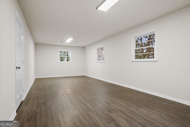 unfurnished room featuring dark hardwood / wood-style floors