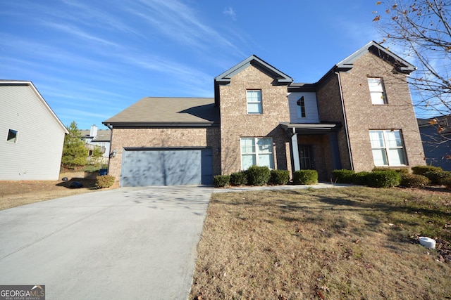 front of property featuring a garage and a front lawn