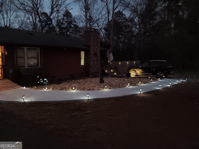 view of property exterior at twilight