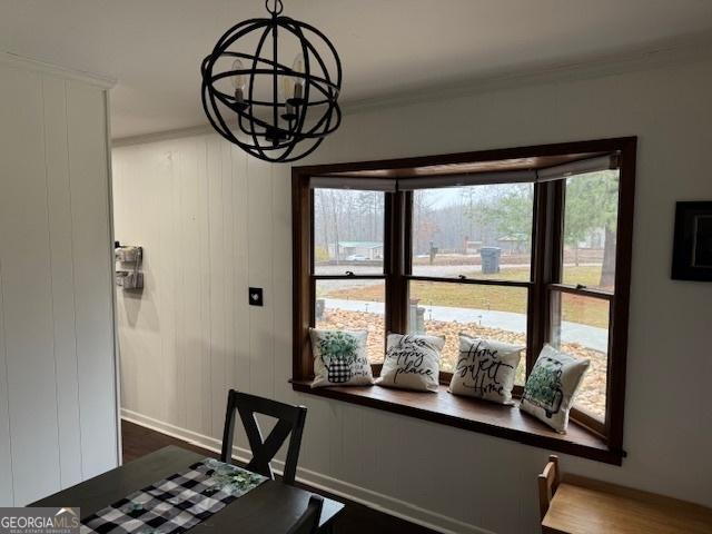 dining room with a chandelier and hardwood / wood-style flooring