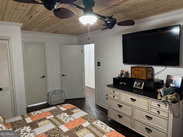 bedroom featuring wood ceiling, ceiling fan, crown molding, and dark wood-type flooring