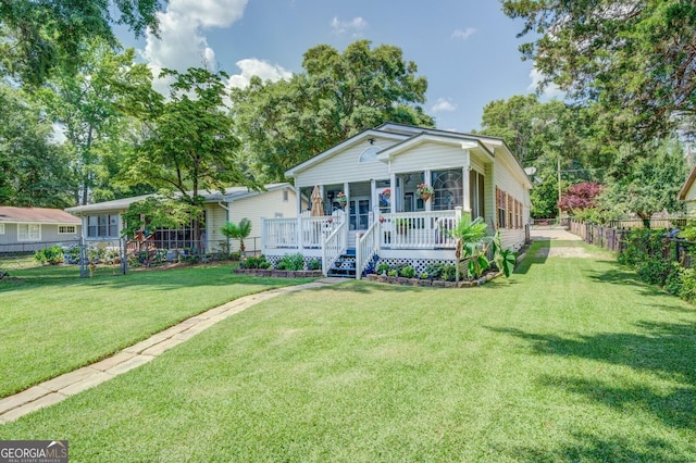 view of front of property with covered porch and a front yard