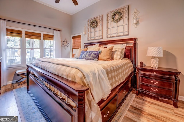 bedroom featuring ceiling fan and light hardwood / wood-style floors