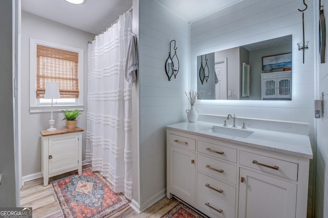 bathroom featuring hardwood / wood-style floors and vanity