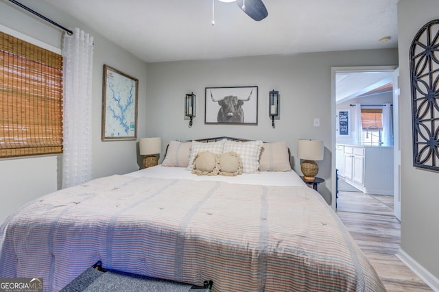 bedroom with light hardwood / wood-style flooring and ceiling fan