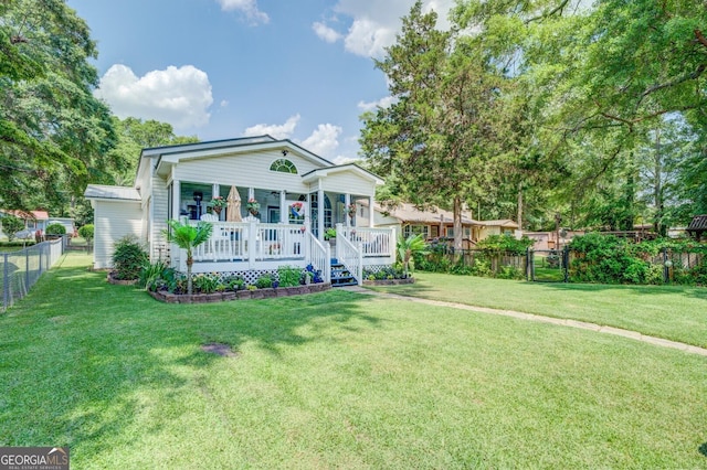 view of front of house with a porch and a front yard