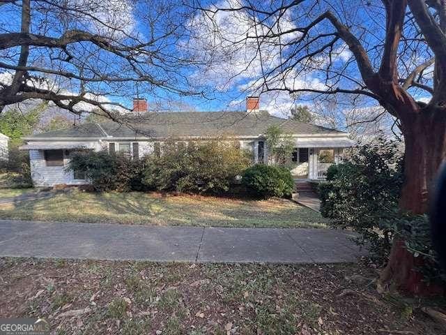 view of front of property with a chimney