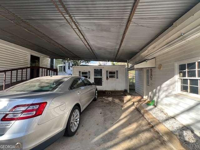 view of car parking featuring an attached carport