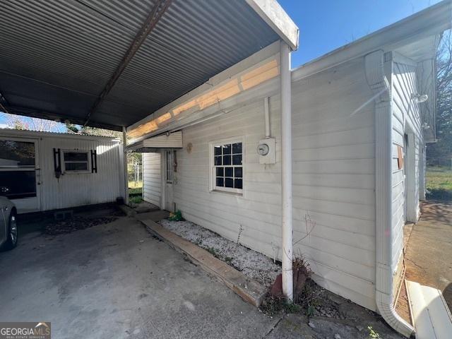 view of property exterior featuring an attached carport