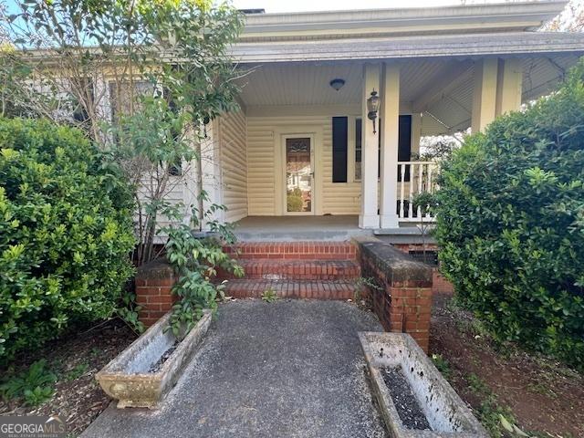 entrance to property with a porch