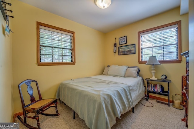 bedroom with light carpet