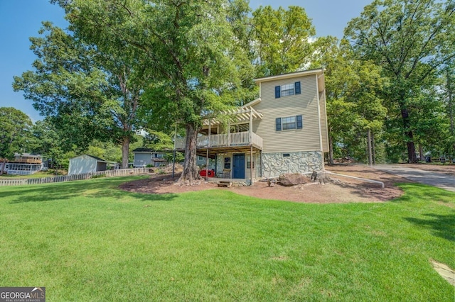 back of property featuring a lawn