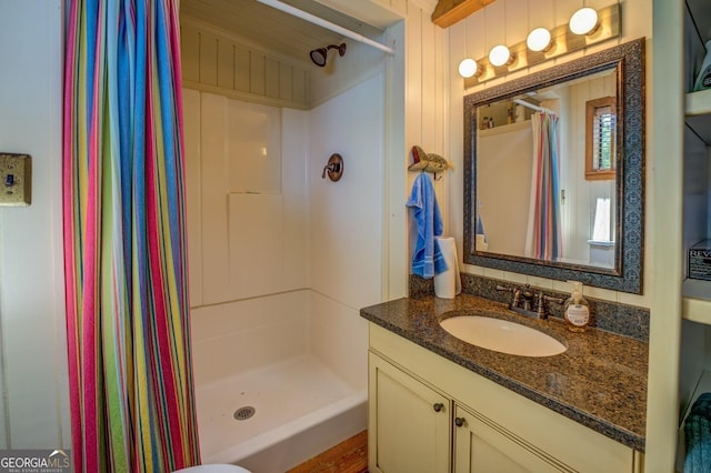 bathroom featuring vanity and a shower with shower curtain