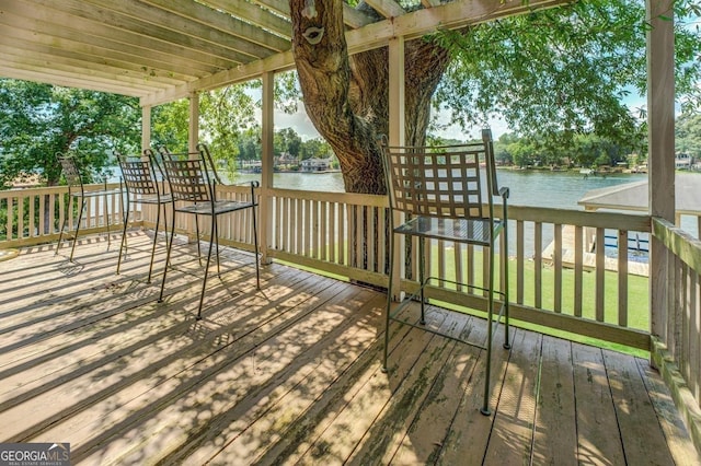 wooden deck featuring a water view