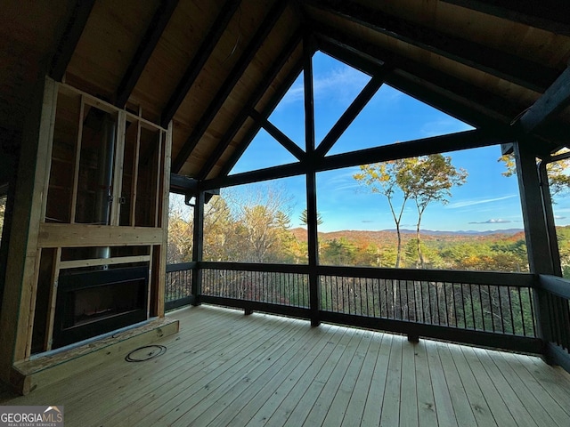 wooden deck with a mountain view