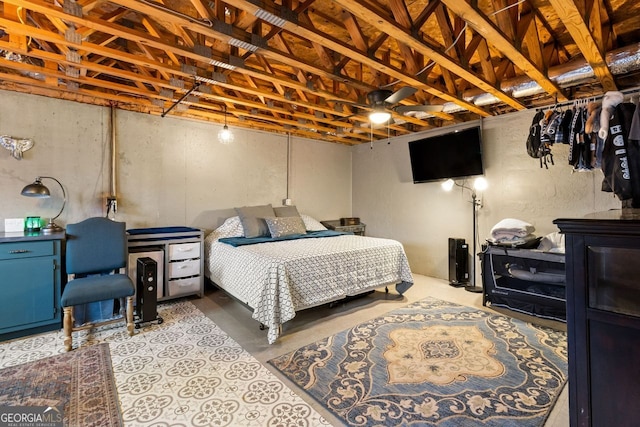 bedroom featuring concrete flooring