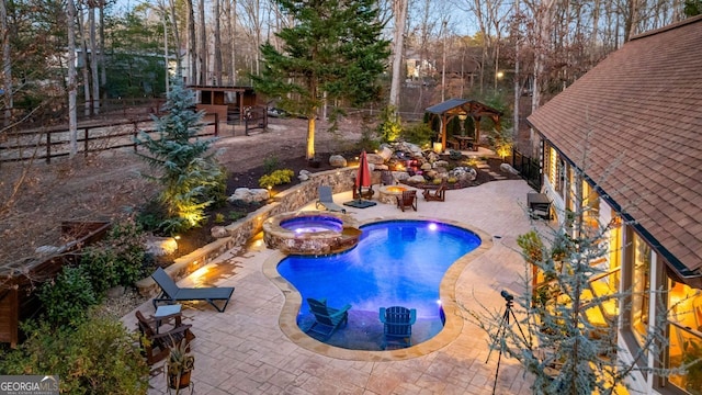 view of swimming pool with an in ground hot tub and a patio area