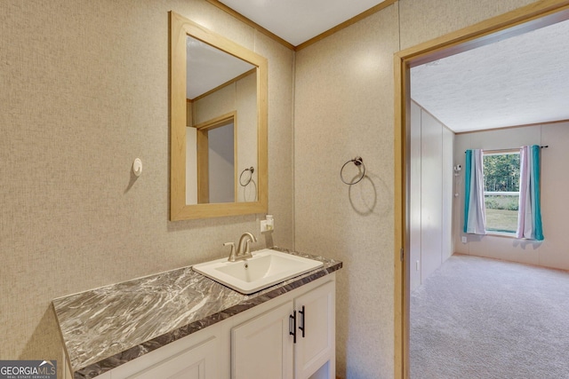 bathroom featuring vanity and crown molding