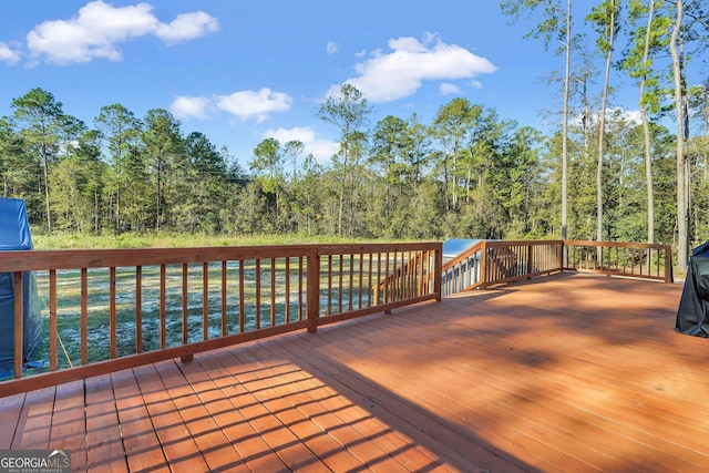 deck featuring a water view