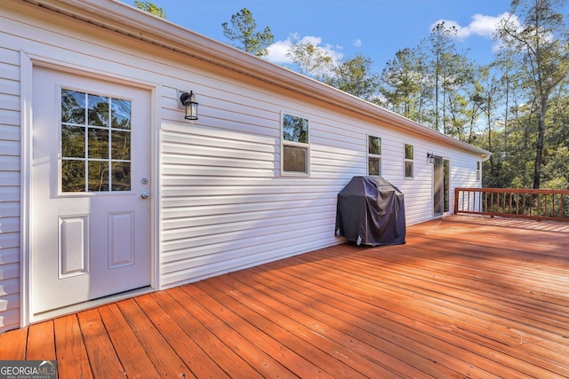 wooden deck featuring grilling area