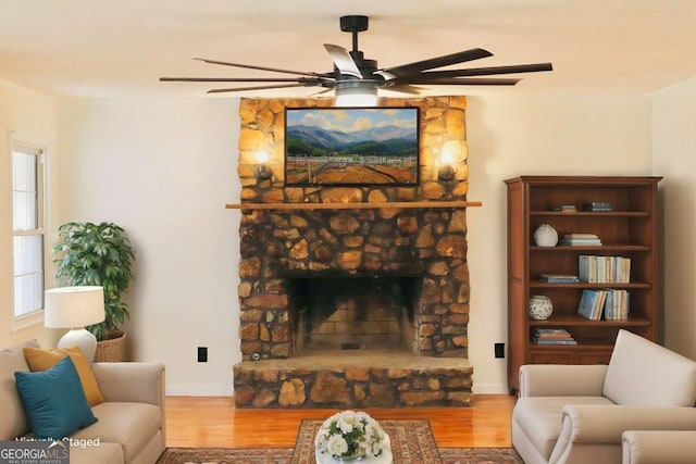 living room featuring a fireplace and wood-type flooring