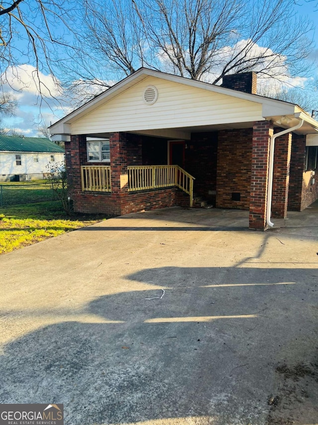 view of front of home with a carport