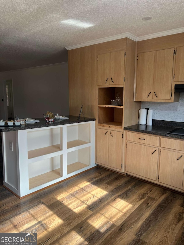 kitchen featuring hardwood / wood-style floors, light brown cabinets, backsplash, ornamental molding, and a textured ceiling