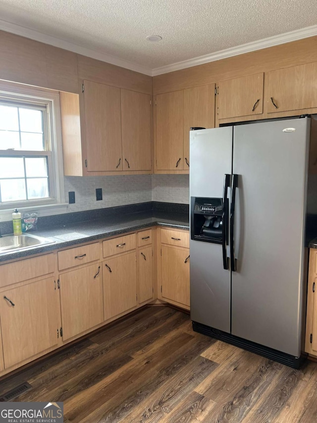 kitchen featuring sink, dark wood-type flooring, stainless steel fridge, a textured ceiling, and light brown cabinetry