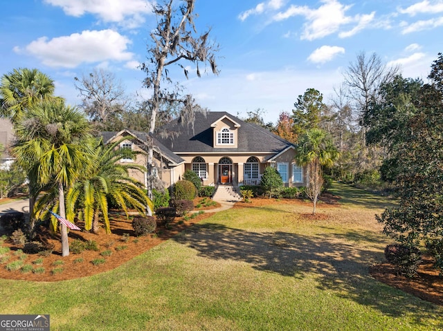 view of front of house featuring covered porch and a front lawn