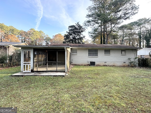 back of property featuring cooling unit, a lawn, and a sunroom