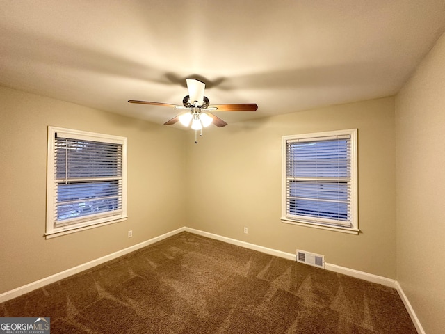 empty room with carpet floors and ceiling fan