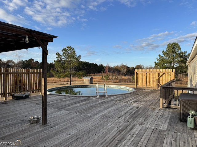 view of pool with a wooden deck